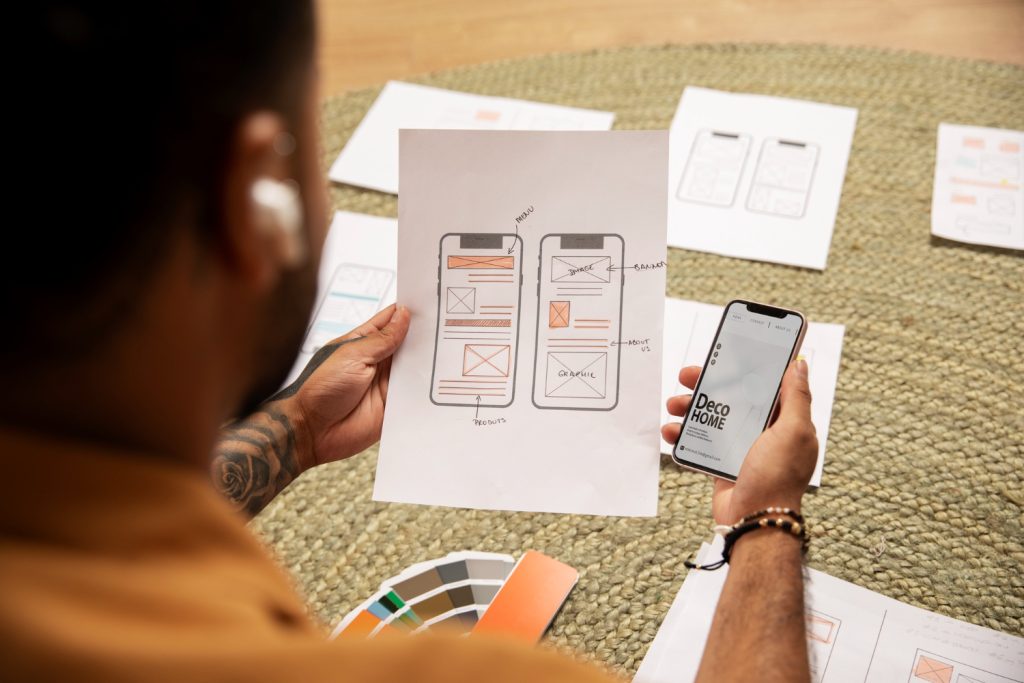UX designer working on landing page wireframe for mobile conversion